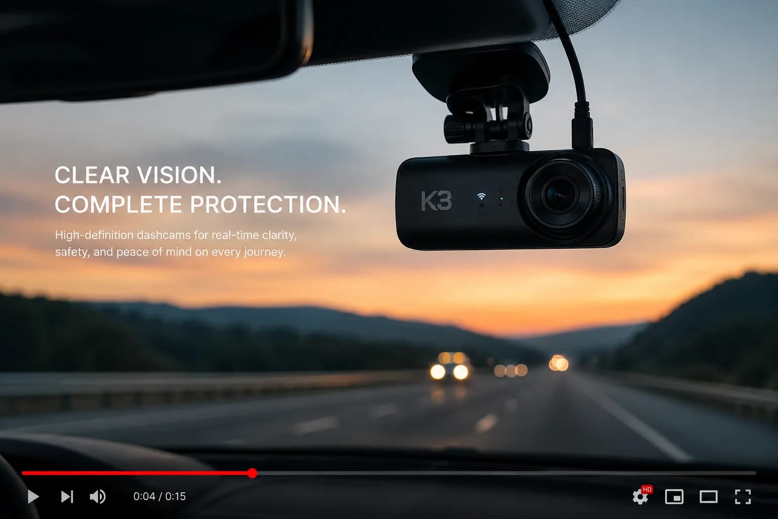 Dashcam mounted on a windshield capturing the road at sunset